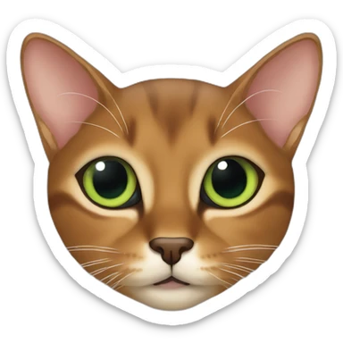 Abyssinian cat chews a smallgreen fur ball sticker