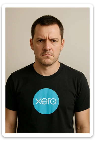 man, short brown hair, Xero logo t-shirt, not amused, minimal background sticker