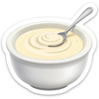 bowl of creamy garlic aioli sauce with a spoon sticker