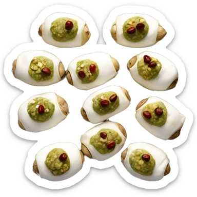 Multiple dates stuffed down the center with goat cheese and pistachios on a tray sticker