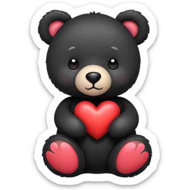 Black stuffed bear with a heart sticker