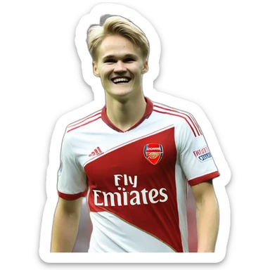 Martin Odegaard Martin Odegaard celebrates wearing an Arsenal shirt sticker