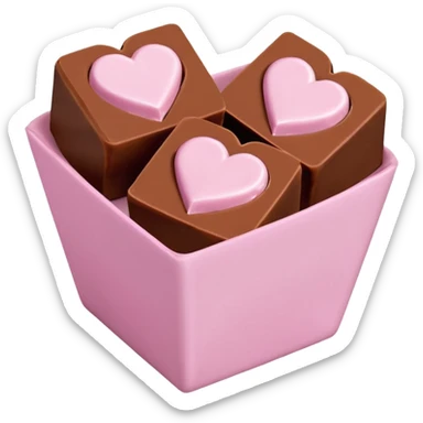 Two square milk chocolate 2 pralines only, Each praline is a sharp-edged cube with smooth glossy chocolate coating, placed in a small white fluted paper candy cup. On top of each cube is a flat pastel pink heart-shaped icing, thin and smooth, slightly translucent, with fine sugar crystal sparkle. sticker