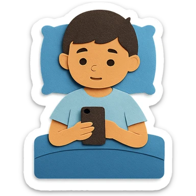boy in a blue bed, on his phone, wearing a light blue t-shirt sticker