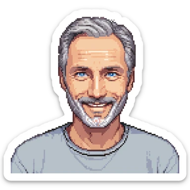 A middle-aged man with a medium black and gray beard, short dark hair cut to the scalp on the sides and combed back on top, blue eyes, smiling sticker