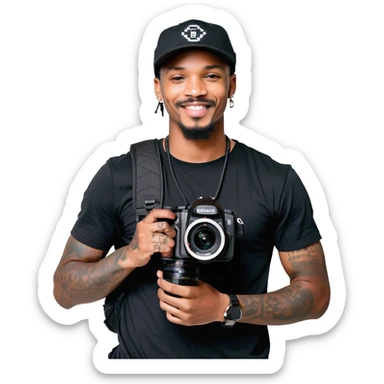 A young, black, South African, male cinematographer dressed in a black round neck t-shirt, black pants and black baseball cap holding a mirrorless dslr camera in one hand. Dark brown eyes. Bright white smile. Minimal facial hair — a small moustache connected to a goatee. Arms covered in tattoos. sticker
