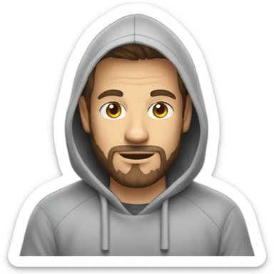 A white software developer in a gray hoodie and with a very short beard in front of an apple laptop sticker