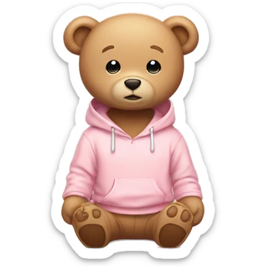 A cute beige teddy bear wearing a light pink hoodie. He is sitting on his butt.  sticker