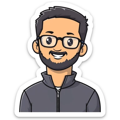 Light-skinned man with short black hair styled upwards, full short graying beard, smiling, wearing large black-framed glasses and a black long-sleeve sports shirt with zip at the neck sticker