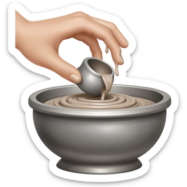 single hand scooping a blob of clay on a silver pottery wheel sticker