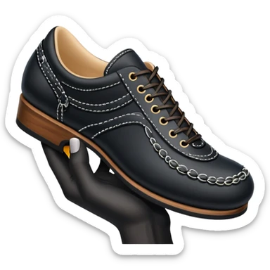 A hand holding Japanese shoe sticker