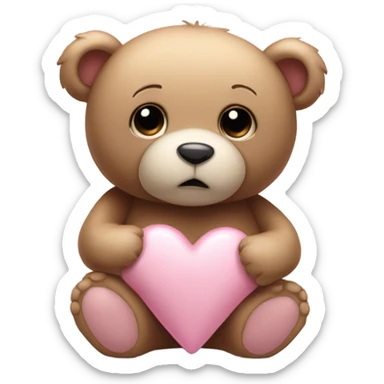 Teddy bear with sad eyes holding a pastel pink heart sticker