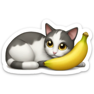 The cat is lying with a banana sticker
