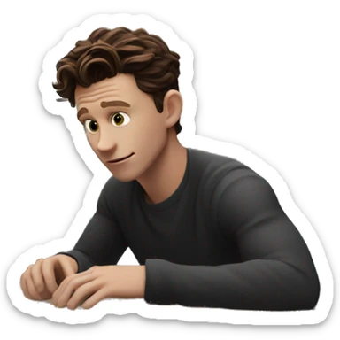 tom holland at his desk looking at his computer sticker