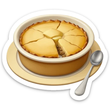 a deep dish plate with a yellowish food in it,  in a bit of small small lumps and very dry, small mountain. with a bit of applesauce on top on the side and a spoon sticking out sticker