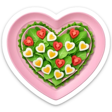 green salad in a light pink heart shaped plate sticker
