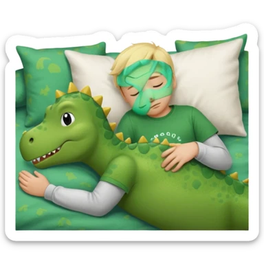 Blond boy sleeping wearing a green dinosaur t-shirt sticker