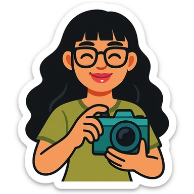 girl with long wavy black hair, bangs, black glasses, pink lip gloss, holding a teal camera, closed smile, light moss green shirt, vibrant cartoon style sticker