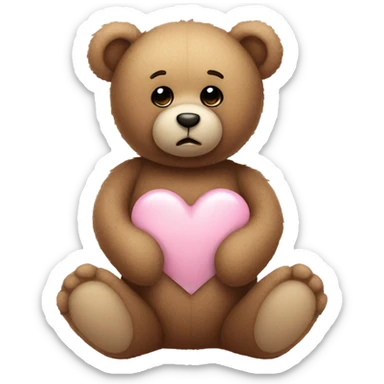 Teddy bear with sad eyes holding a pastel pink heart sticker