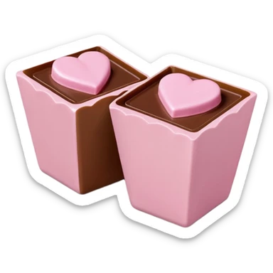 Two square milk chocolate 2 pralines only, Each praline is a sharp-edged cube with smooth glossy chocolate coating, placed in a small white fluted paper candy cup. On top of each cube is a flat pastel pink heart-shaped icing, thin and smooth, slightly translucent, with fine sugar crystal sparkle. sticker