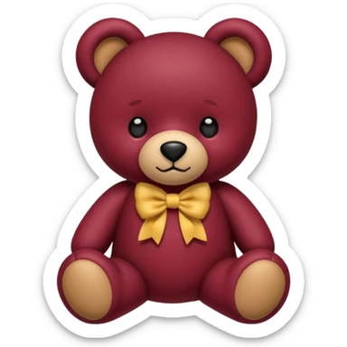 a burgundy teddy bear with a bow sticker