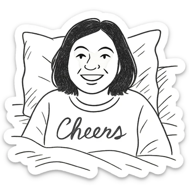 A woman with shoulder-length black hair, light to medium skin tone, full cheeks, and almond-shaped eyes, wearing a white sweater with the word 'cheers' in gold script, lying comfortably on a bed with soft lighting, joyful and radiant expression sticker