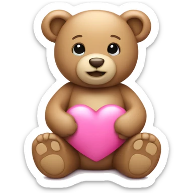 tan teddy bear holding a pink heart sticker