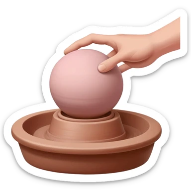 one hand pressing down on a pink ball of clay above an empty pottery wheel, with the clay not touching the wheel surface, hovering slightly above it sticker