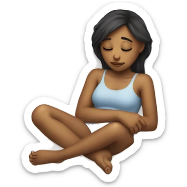 A girl laying down holding her stomach with a sad face sticker