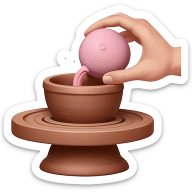one hand throwing a pink ball of clay onto a completely empty pottery wheel with no pottery or other clay on it sticker