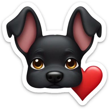 Black dog with up ears holding heart sticker