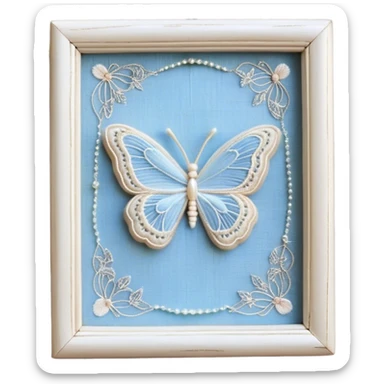An antique ivory ribbon, embroidered with delicate silver filigree, twists gracefully over a weathered wooden table. A pale blue butterfly, its wings kissed with hints of opalescent shimmer, lands softly on the knotted bow. Around it, tiny pearl beads are scattered like dewdrops, catching the soft glow of candlelight. sticker