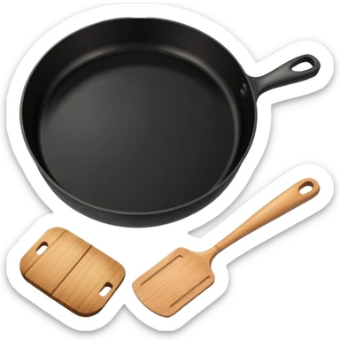 a black pan and spatula inside sticker