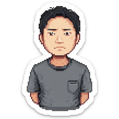 Asian man in a gray shirt with a frown sticker