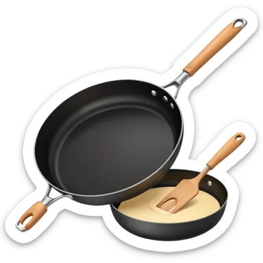 a black pan and spatula inside sticker
