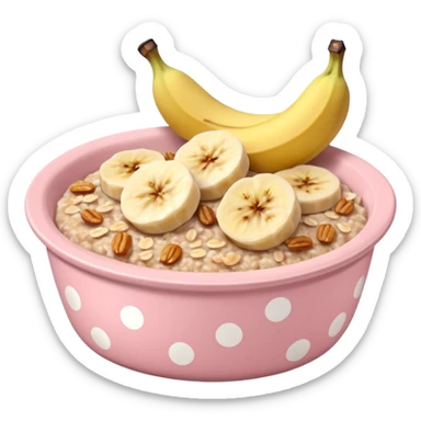 baked oats in a bowl like oat meal with a couple banana slices on top that look a little bit caramelised and a light pink bowl with white polka dots sticker