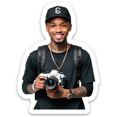 Young African cinematographer with tattoo-covered arms, wearing all black clothing and a baseball cap, holding a DSLR camera. Has dark brown eyes, a bright smile, and a small goatee. sticker