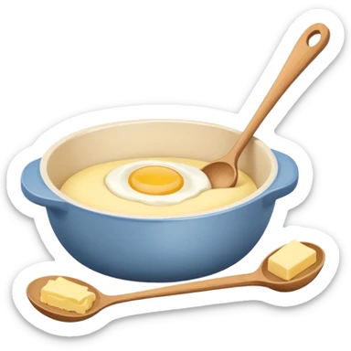 A cream ceramic baking bowl with a wooden spoon in it, next to it is a carton of eggs and butter sticker