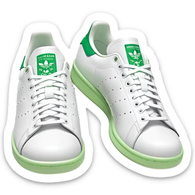 Two Adidas Stan Smith shoes arranged as a pair with one slightly behind the other, white with green heel details, clean classic design sticker