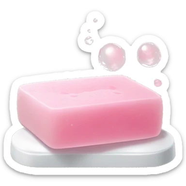 Light pink soap bar sitting on a soap holder, with soap bubbles  sticker