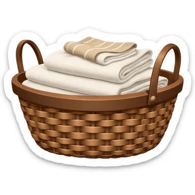 A woven Brown basket with fresh washed linen, white towels  sticker