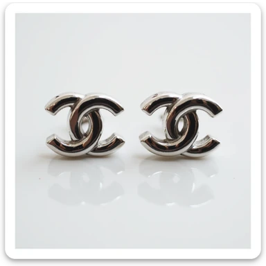 photorealistic pair of silver Chanel logo stud earrings, elegant sticker