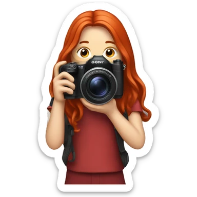 A photographer with red long hair and a Sony camera sticker