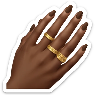 gold rings on the hand with a brown manicure sticker