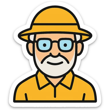 An elderly man with white hair and beard, wearing glasses and a yellow explorer hat sticker