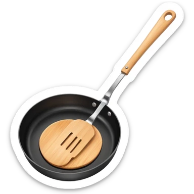 a black pan and spatula inside sticker