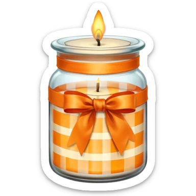 Glass jar with a candle in it and an orange checkered ribbon sticker