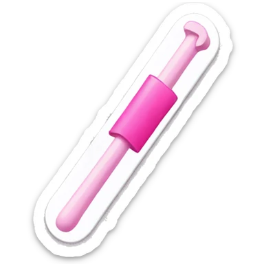 White flat plastic stick with pink end and pink positive sign sticker