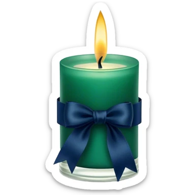 A charmingly arranged composition of a glass candle in a rich emerald shade, placed next to a carefully folded navy blue ribbon. sticker