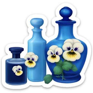 Decorative blue candle in a glass jar and in the back are navy blue pansies and a blue vintage-style perfume bottle  sticker